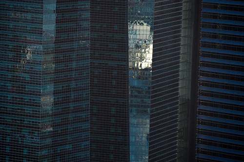 high rise blue curtain glass wall buildings city